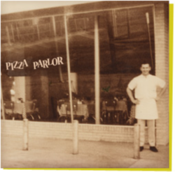 Ken Selby in front of Pizza Parlor